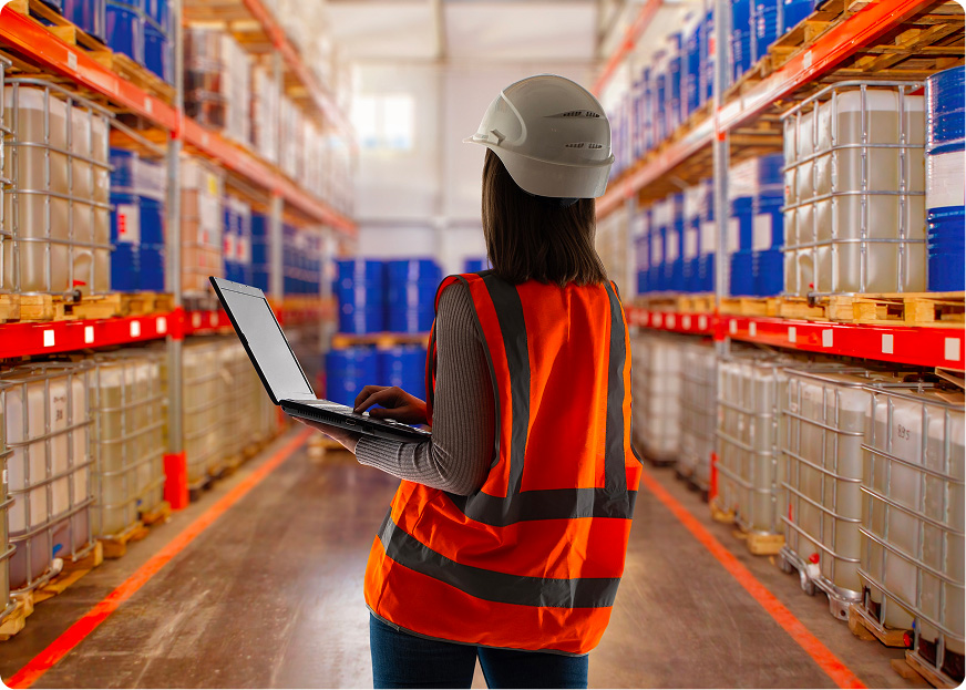 Worker in a modern chemical logistics warehouse